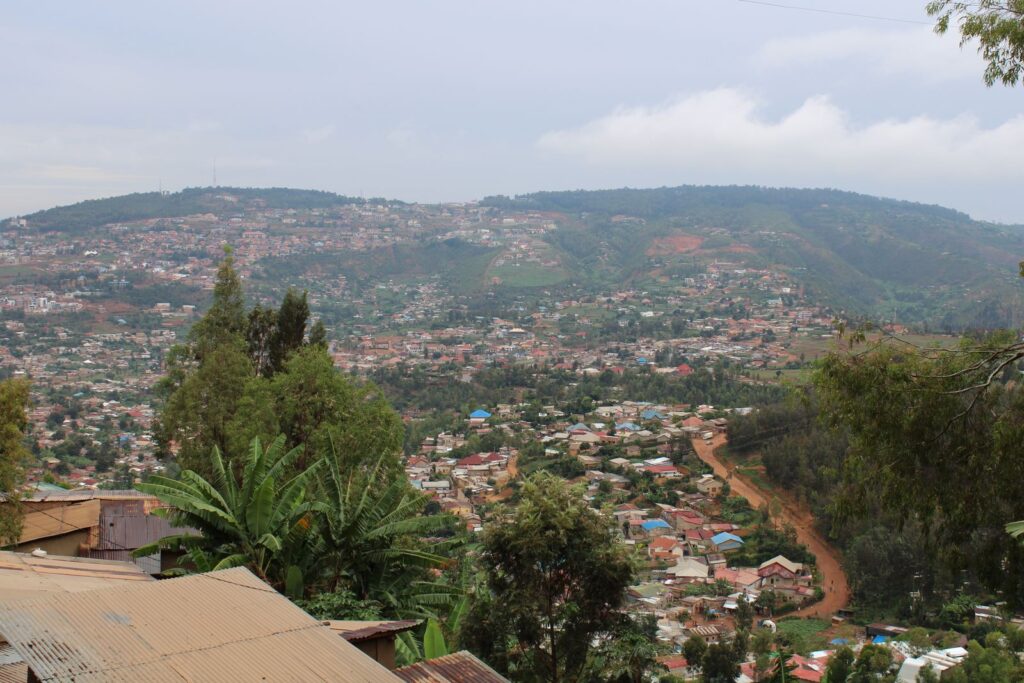 Aerial view of green hills and rooftops in Kigali, Rwanda