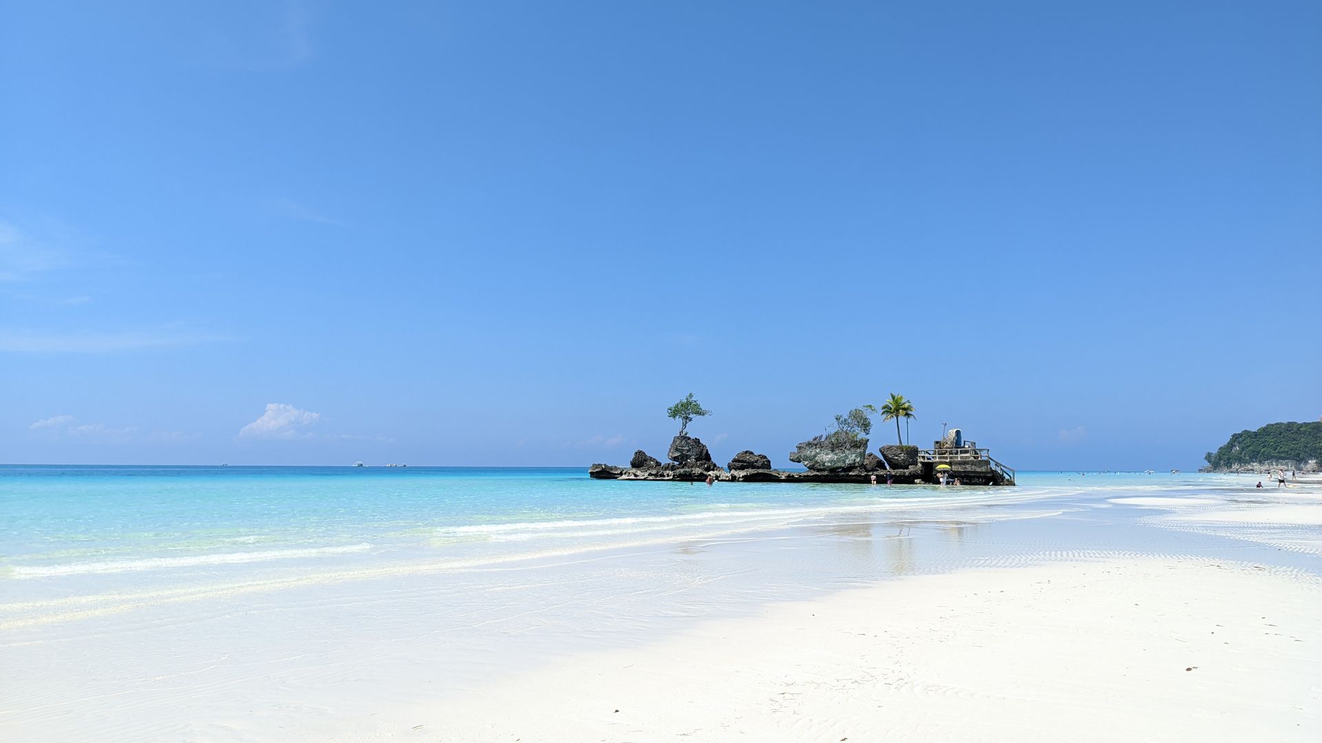 Tropical white-sand beach with turquoise ocean water